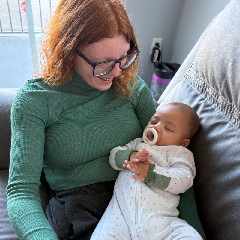 Brandy Coomer holding a baby
